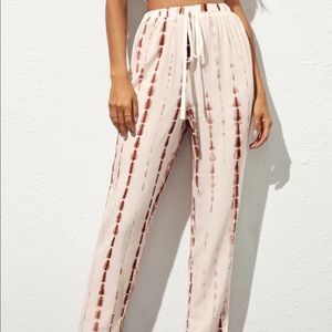 Tie waist tye dye pants.